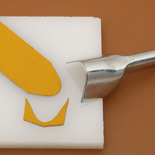 V-shaped leather edge punch with curved V tip for belt edge trimming.