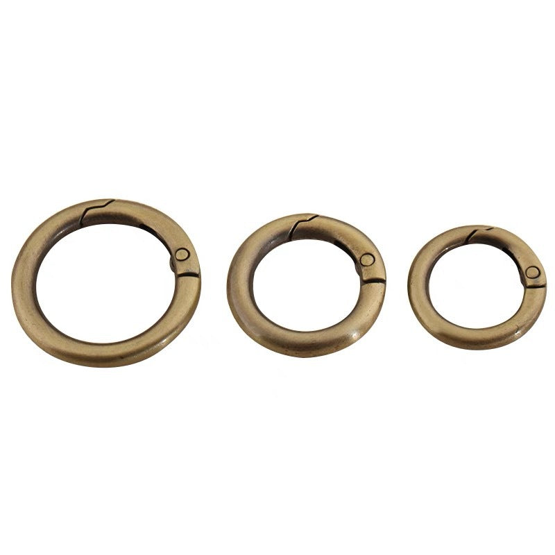 Set of three antique gold zinc alloy spring open split rings