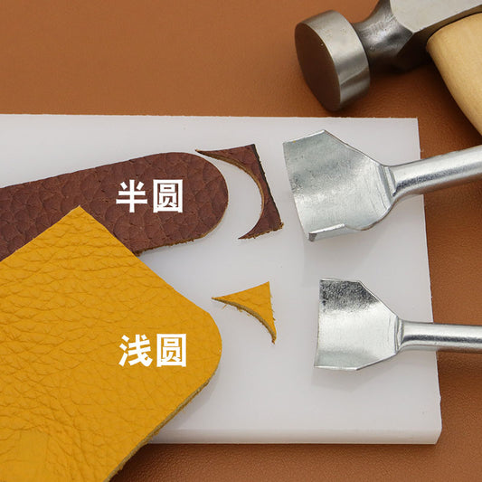 Semicircle leather punch set with silver cutters, positioned over leather scraps