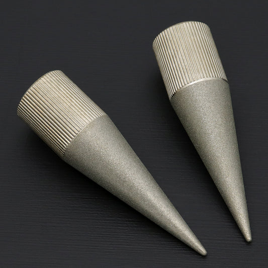 Tapered emery grinder tool with ribbed grip and pointed tip