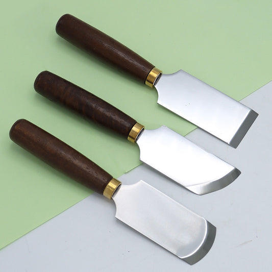 Leather skiving knife set with dark walnut handles, brass ferrules, and steel thinning blades