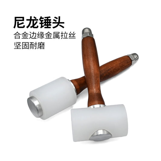 Nylon head mallet with wooden handle, white dual striking ends and metal collar
