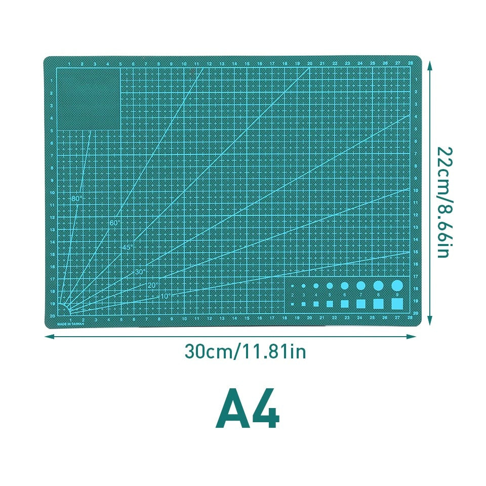 Self-healing cutting mat with green grid lines and measurement markings, A4 size