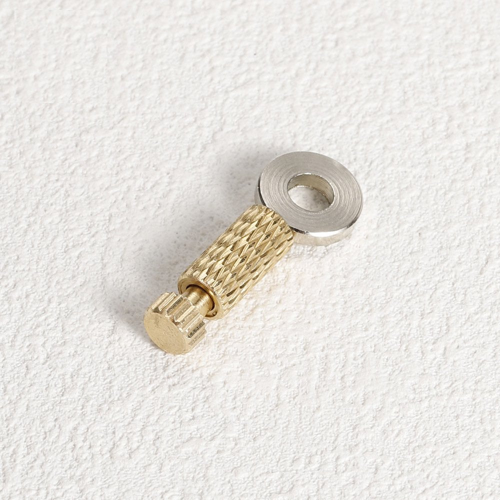 Brass leather positioning needle with silver ring, textured brass grip, and clamp tip