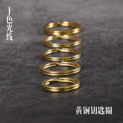 Solid brass key ring set, five stacked round loops with polished gold finish