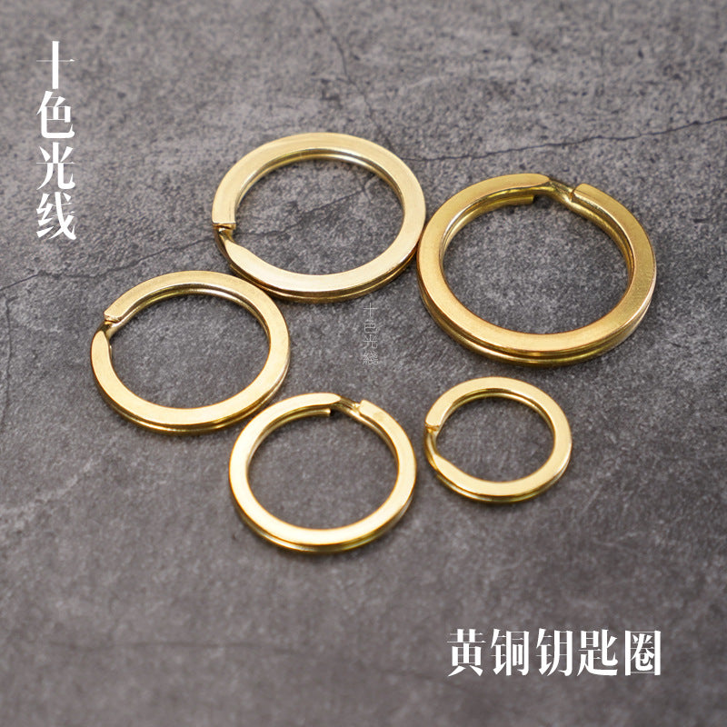 Solid brass key ring set with four round rings: two large, two small