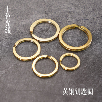 Solid brass key ring set with four round rings: two large, two small