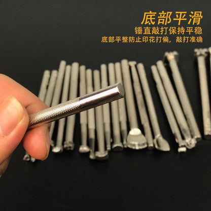 Metal leather stamping tool held in hand, textured handle with plated emboss head