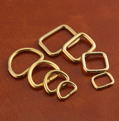 Brass D-ring and square buckle set, mixed shapes and sizes shown together