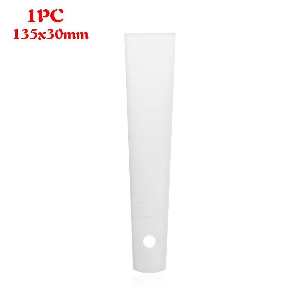 White plastic glue applicator strip with round hole and tapered bottom end