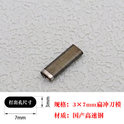 Small oblong hole punch die cutter block, showing circular cutting end