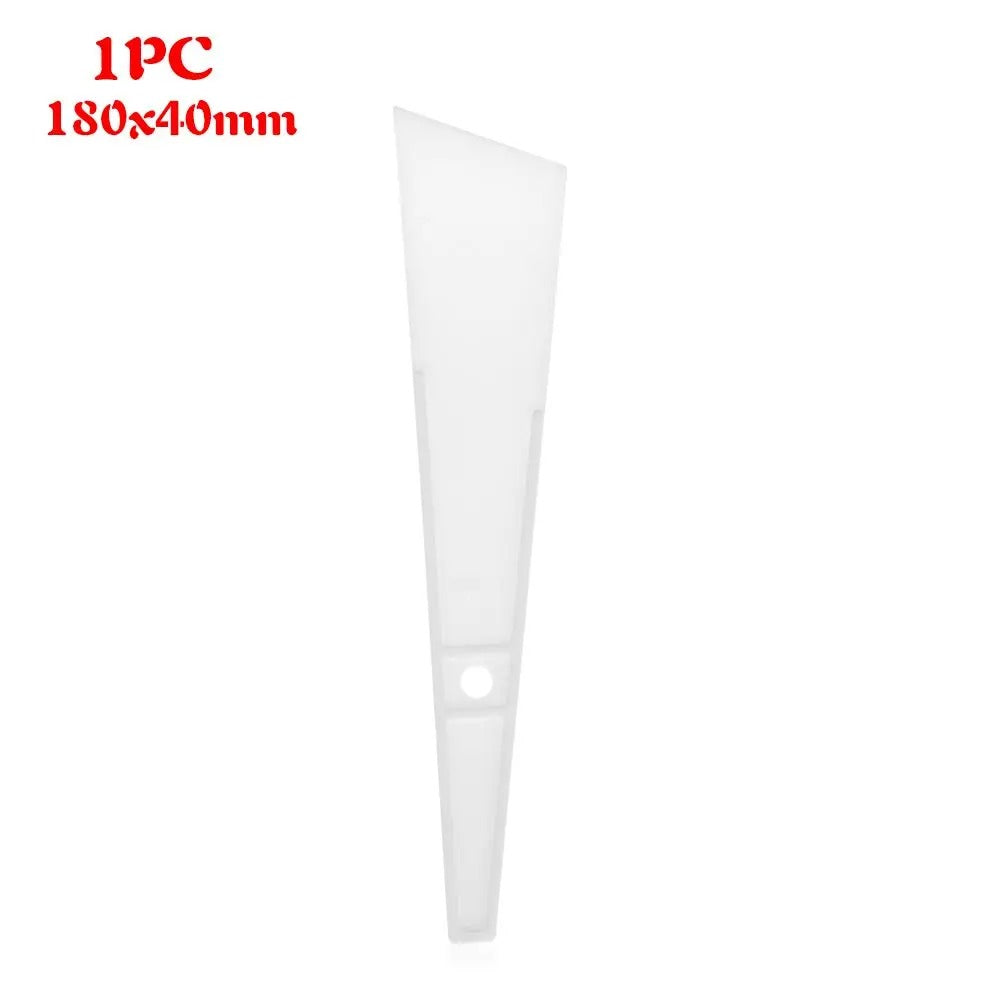 White plastic glue applicator wedge with round hole at the base