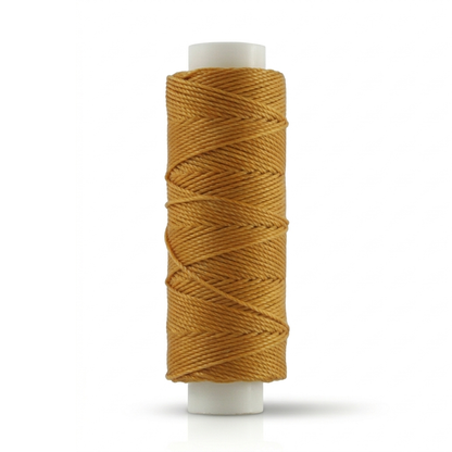 Waxed round thread spool in golden brown, coiled on white plastic reel
