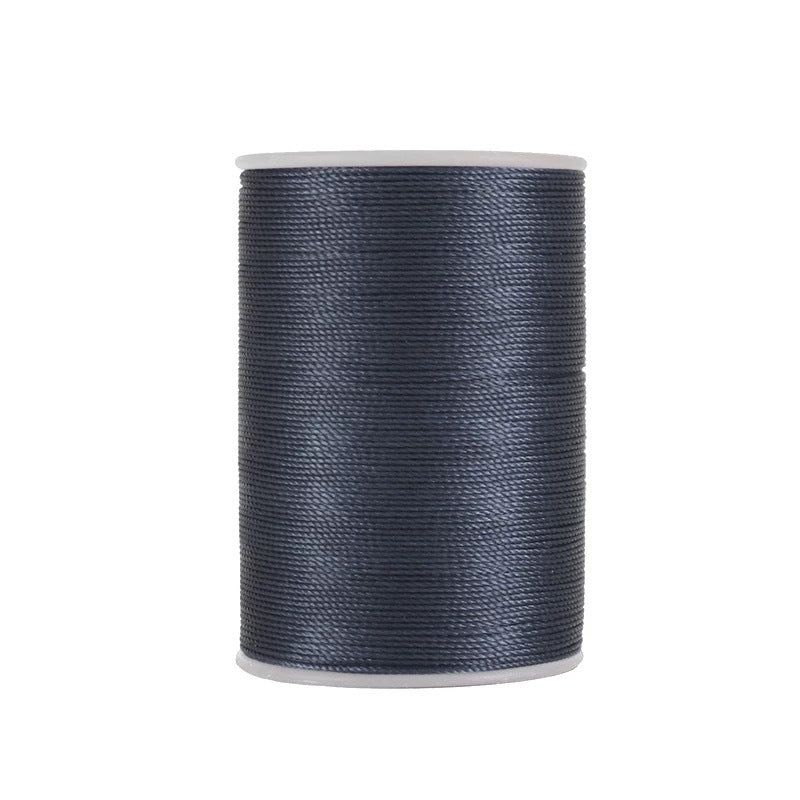 Waxed leather stitching thread spool in dark blue