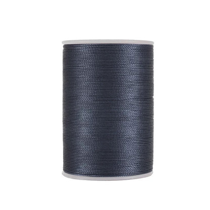Waxed leather stitching thread spool in dark blue