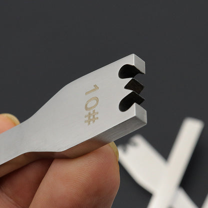 Stainless steel #10 zipper detatcher tool, close-up of notched end