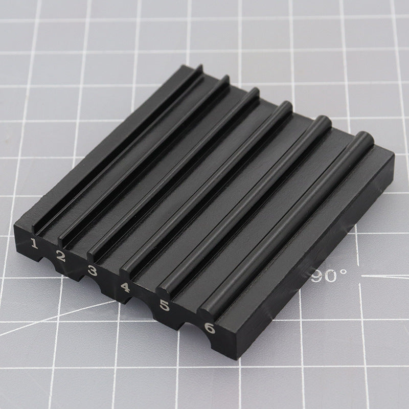 Black beveler & skiving knife sharpener tool with numbered ridges and 6mm guide