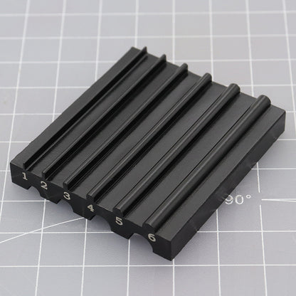 Black beveler & skiving knife sharpener tool with numbered ridges and 6mm guide