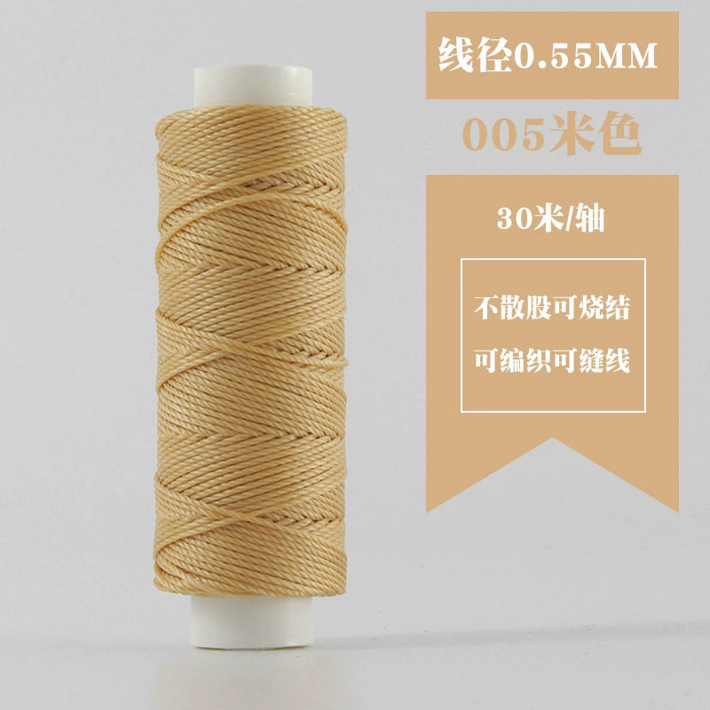 Beige waxed round thread spool, tightly coiled on white plastic reel