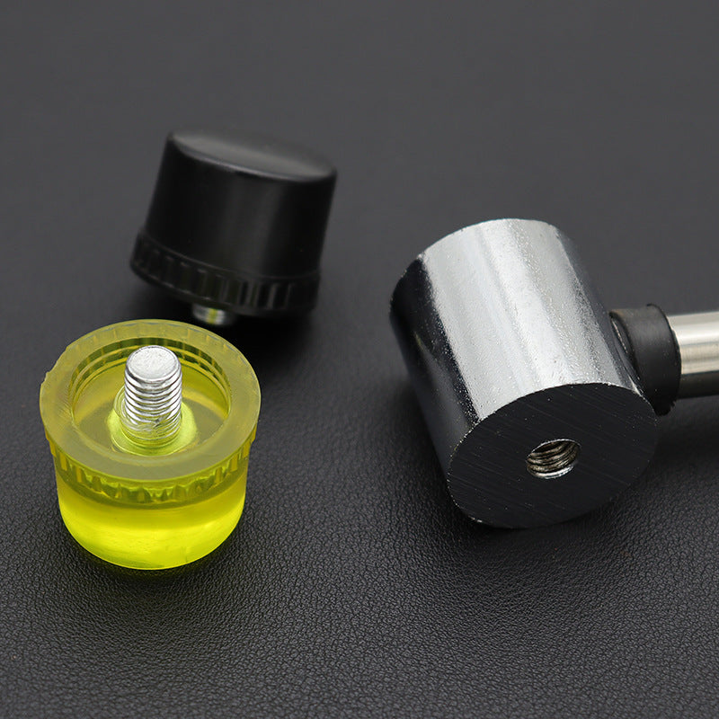 Interchangeable rubber mallet heads, yellow and black, with metal inserts