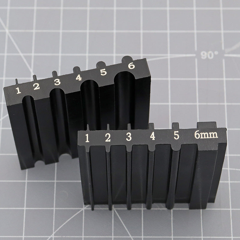 Black beveler & skiving knife sharpener tool with two rows of slots and 6mm label
