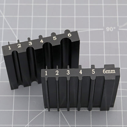 Black beveler & skiving knife sharpener tool with two rows of slots and 6mm label