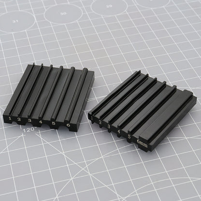 Pair of black beveler & skiving knife sharpener tools with numbered slots and 6mm guide