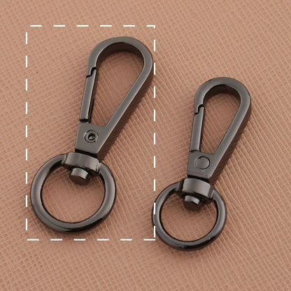 Swivel lobster claw hook buckles in gunmetal-tone metal, showing small and large rings