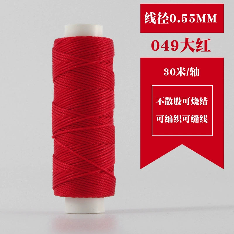 Waxed round thread spool in bright red