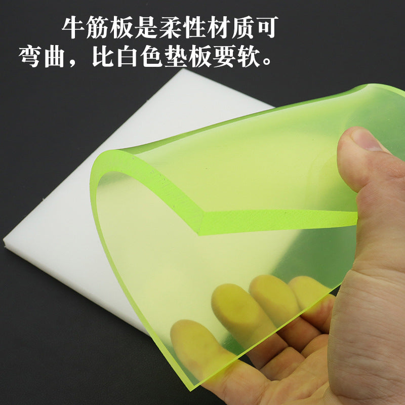 Green punching pad board with flexible foam feel, shown held in a hand