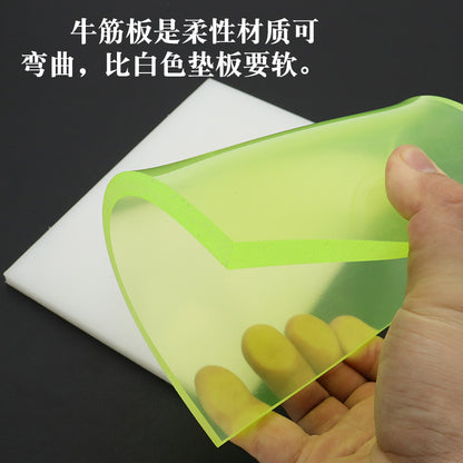 Green punching pad board with flexible foam feel, shown held in a hand