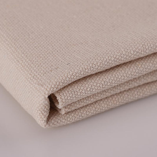Off-white canvas polishing cloth, folded corner detail