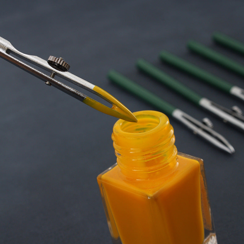 Yellow oil dye bottle with duckbill applicator tip and metal handle