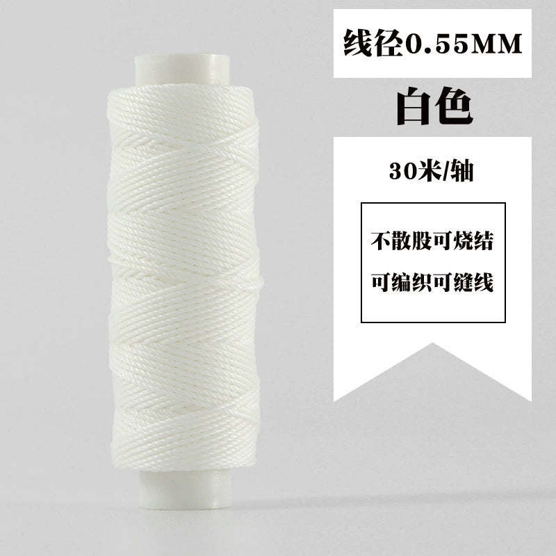White waxed round thread spool, tightly coiled on white plastic reel