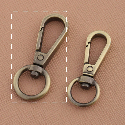 Swivel lobster claw hook buckles in dark and light antique tones, small and large rings