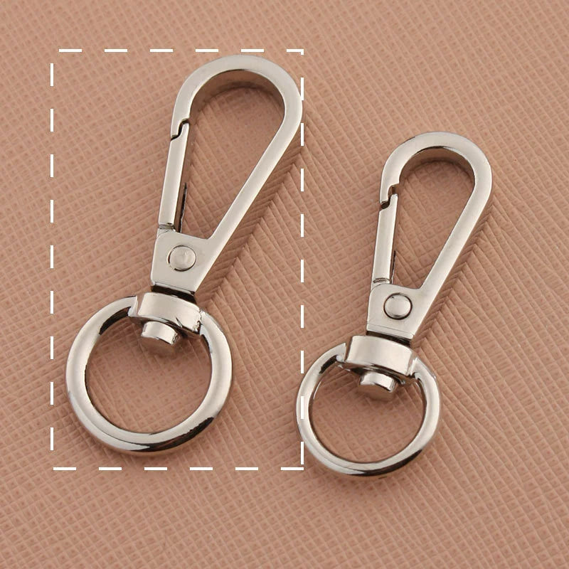 Swivel lobster claw hook buckles in silver-tone, showing small and large rings