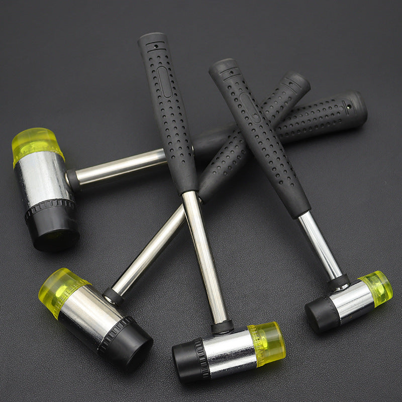 Rubber mounting hammer set with four black rubber grips and steel handles with yellow caps