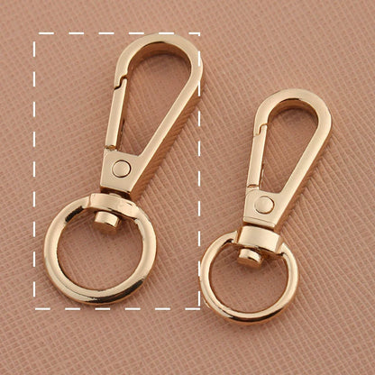 Swivel lobster claw hook buckles in antique gold-tone, showing small and large rings