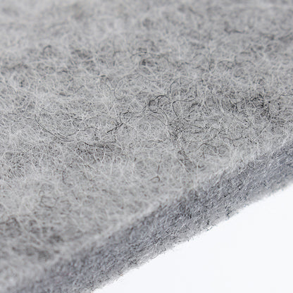 Light grey felt mat close-up, dense fibrous surface texture