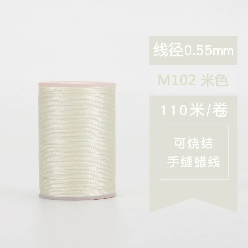Waxed leather stitching thread spool in off-white