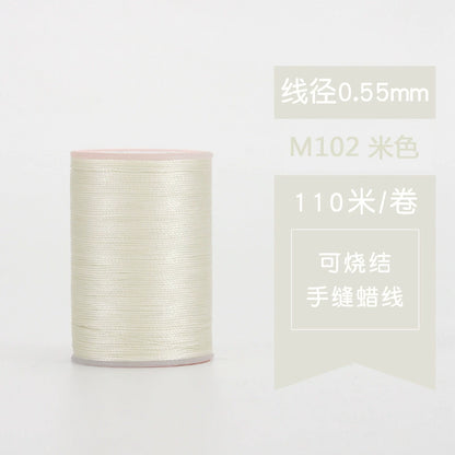Waxed leather stitching thread spool in off-white