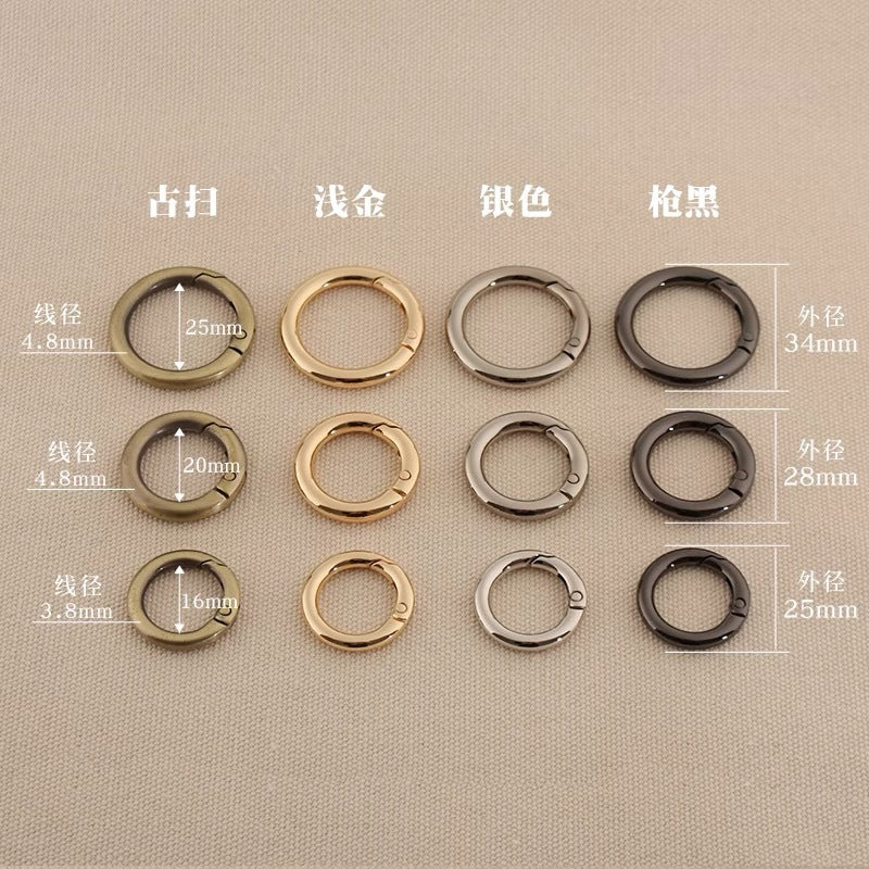 Zinc alloy spring open split rings in silver, gold, gun metal, and dark finishes