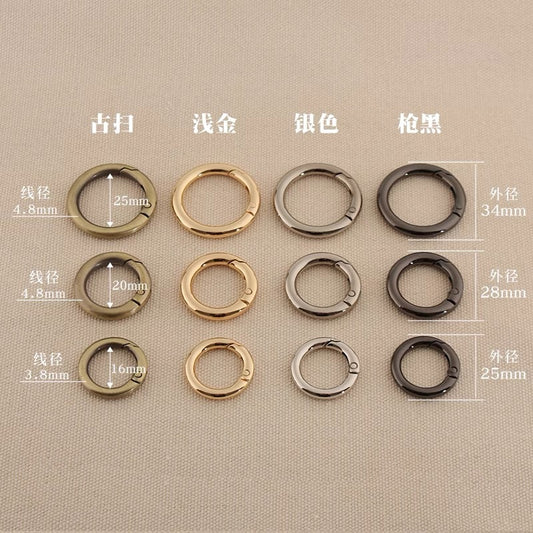 Zinc alloy spring open split rings in silver, gold, gun metal, and dark finishes