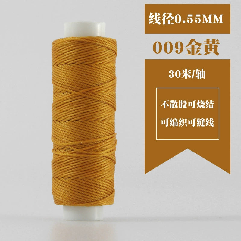 Golden waxed round thread spool, tightly coiled on white plastic reel