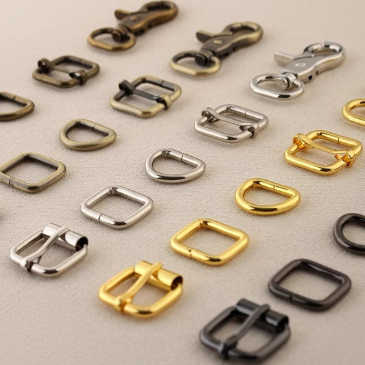 Bag hardware set assorted metal swivel hooks, rings, and buckles in silver, gold, and dark tones