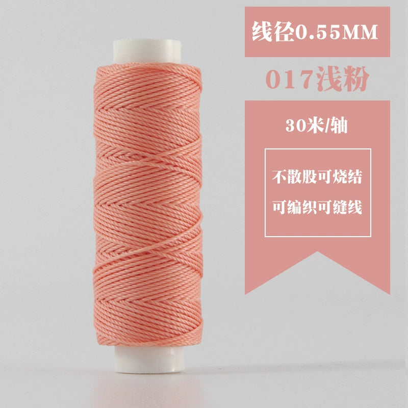 Waxed round thread spool in pale pink