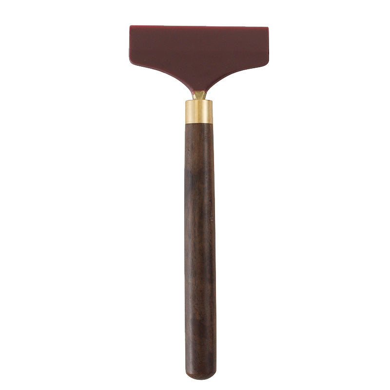 Silicone glue scraper spreader tool: maroon rubber head and dark brown wood handle