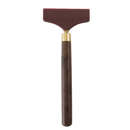 Silicone glue scraper spreader tool: maroon rubber head and dark brown wood handle