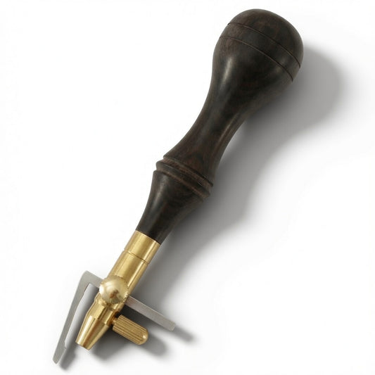 Dark brown leather handle with brass edge cutter tip
