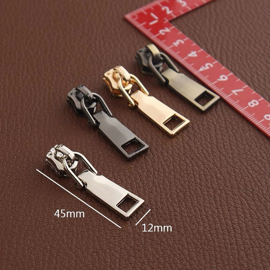 Zinc alloy zipper pull slider with square cutout, size marked 45mm x 12mm